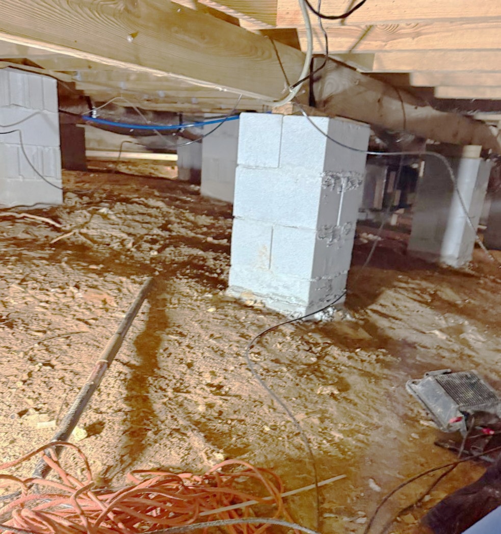 Crawl space before remediation and encapsulation treatment